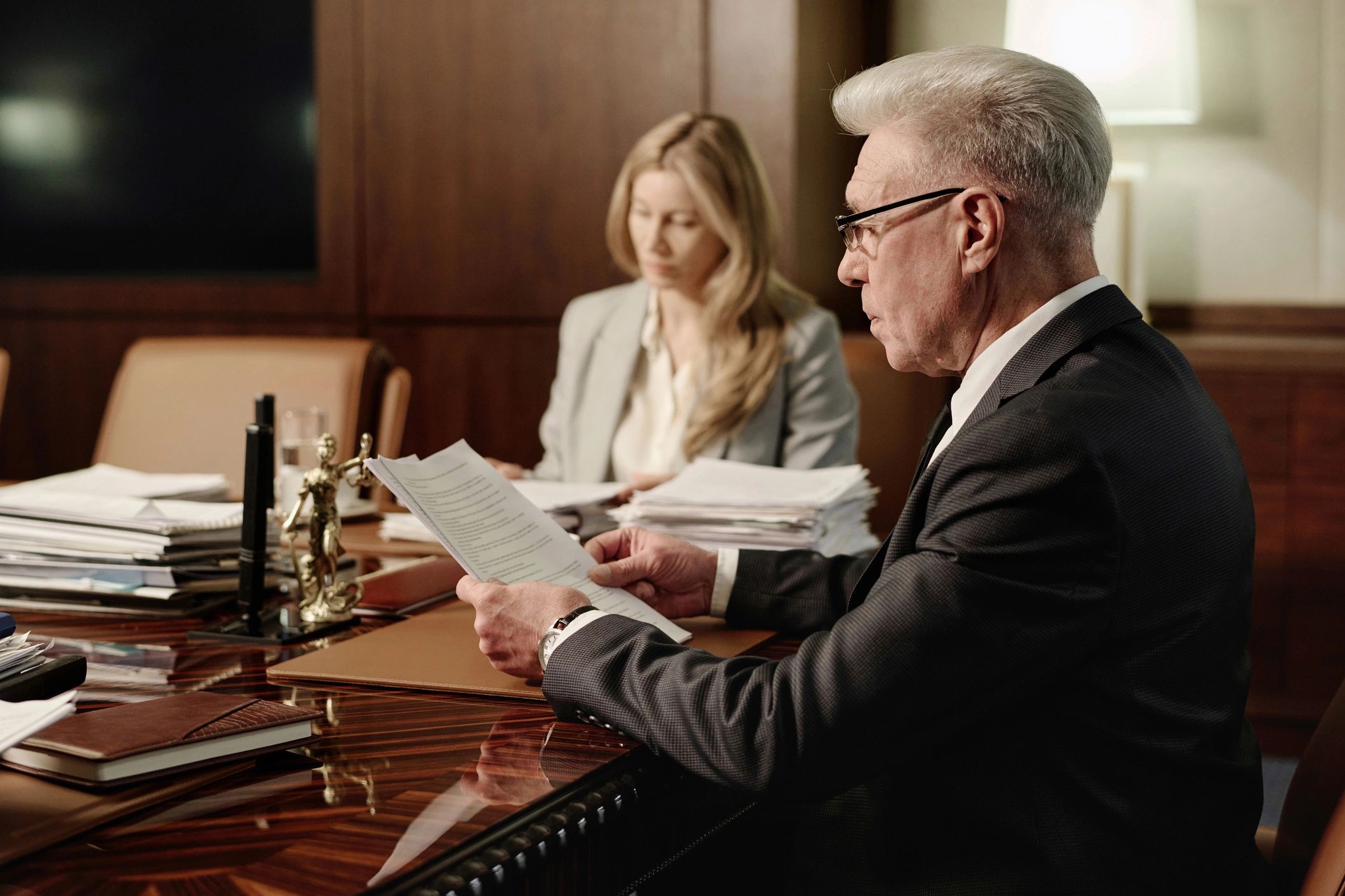 Attorneys reviewing probate documents in a conference room