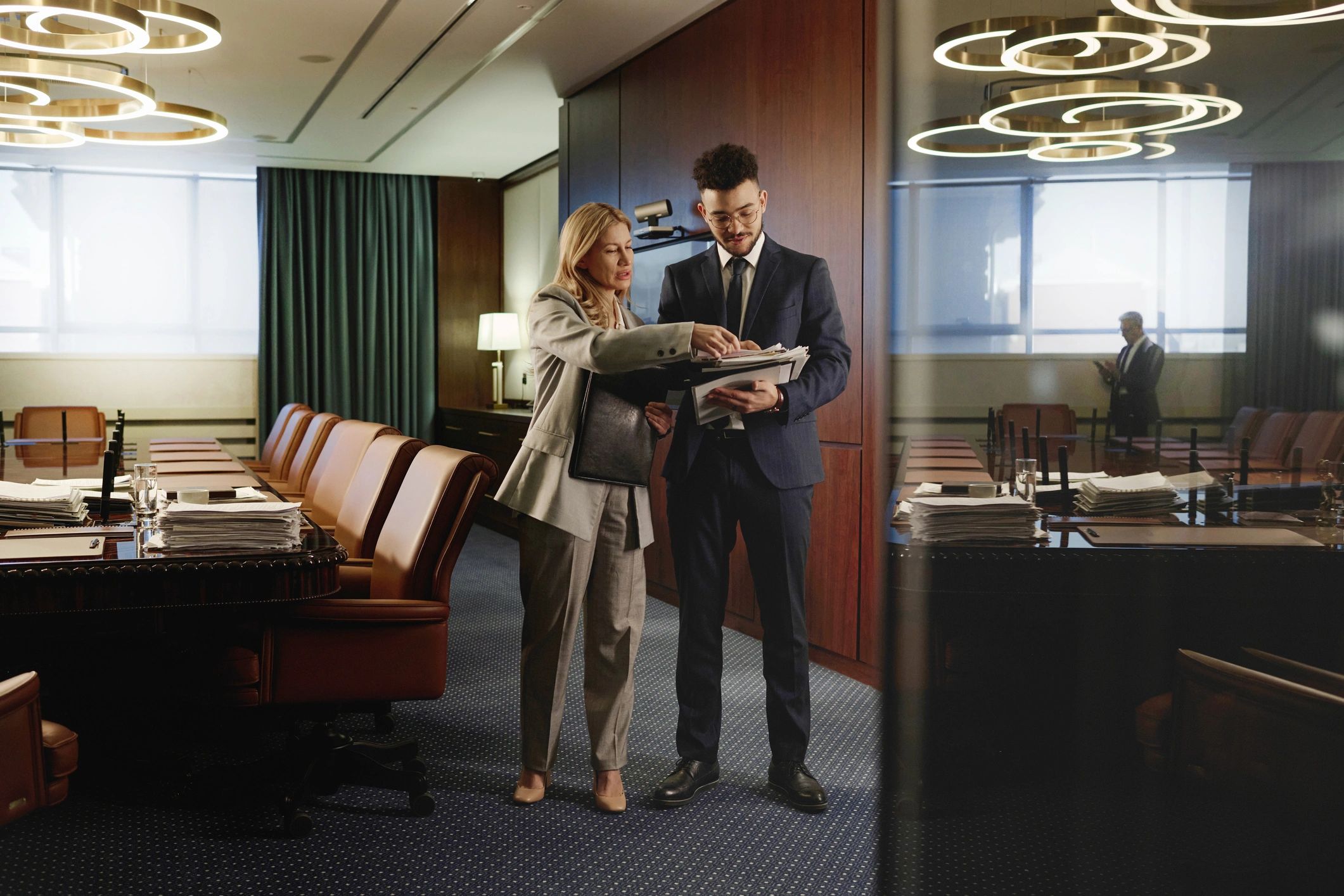 Attorneys reviewing documents in a professional conference room